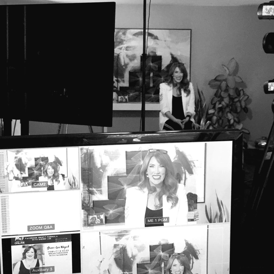 A virtual event control setup with a presenter on screen and multiple camera feeds.